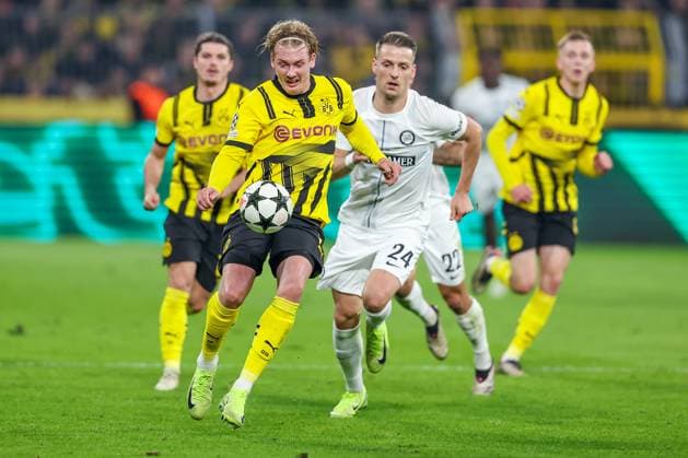 05.11.2024, Fußball, UEFA Champions League, Borussia Dortmund - SK Sturm Graz, 4. Spieltag, Signal Iduna Park, Saison 2024 2025: Julian Brandt (BVB 10) gegen Dimitri Lavalee (Graz 24) Nordrhein-Westfalen Deutschland