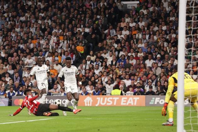 Madrid, Spain, 5th November 2024. Emerson Royal of AC Milan fouls Vinicius Junior of Real Madrid giving away a penlaty during the UEFA Champions League match at the Santiago Bernabau, Madrid. Picture credit should read: Jonathan Moscrop Sportimage EDITORIAL USE ONLY. No use with unauthorised audio, video, data, fixture lists, club league logos or live services. Online in-match use limited to 120 images, no video emulation. No use in betting, games or single club league player publications. SPI-3425-0017