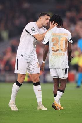 Football - UEFA Champions League - League Phase - Liverpool v Bayer Leverkusen 5th November 2024 - UEFA Champions League - League Phase - Liverpool v Bayer Leverkusen - Granit Xhaka of Bayer Leverkusen talks to Jeremie Frimpong of Bayer Leverkusen - Photo: Simon Stacpoole Offside. Liverpool UK Copyright: xSimonxStacpoolexOffside