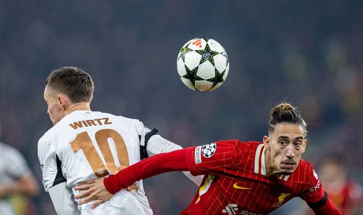 Football - UEFA Champions League - League Phase - Liverpool FC v Bayer Leverkusen LIVERPOOL, ENGLAND - Tuesday, November 5, 2024: Liverpool s Kostas Tsimikas (R) and Bayer Leverkusen s Florian Wirtz during the UEFA Champions League game between Liverpool FC and Bayer Leverkusen at Anfield. (Photo by David Rawcliffe Propaganda) LIVERPOOL Anfield MERSEYSIDE ENGLAND  Copyright: xDavidxRawcliffex P2024-11-05-Liverpool_Leverkusen-24