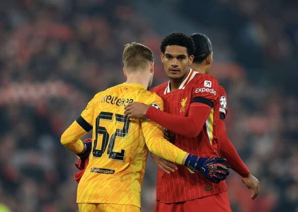 Liverpool, England, 5th November 2024. Jarell Quansah of Liverpool celebrates with Caoimhin Kelleher of Liverpool during the UEFA Champions League match at Anfield, Liverpool. Picture credit should read: Jessica Hornby Sportimage EDITORIAL USE ONLY. No use with unauthorised audio, video, data, fixture lists, club league logos or live services. Online in-match use limited to 120 images, no video emulation. No use in betting, games or single club league player publications. SPI-3439-0090