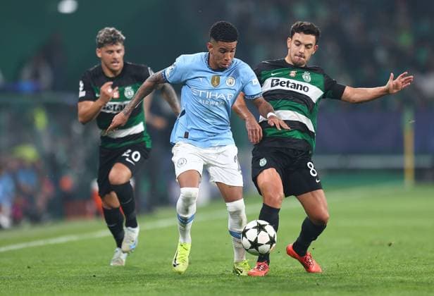Savinho of Manchester City competes for the ball with Pote of Sporting Lisbon Sporting Lisbon v Manchester City, UEFA Champions League, Group Stage, Football, Estadio Jose Alvalade, Lisbon, Portugal - 05 Nov 2024 EDITORIAL USE ONLY No use with unauthorised audio, video, data, fixture lists, club league logos or live services. Online in-match use limited to 120 images, no video emulation. No use in betting, games or single club league player publications.  Copyright: xMichaelxZemanek Shutterstockx 14863776ee