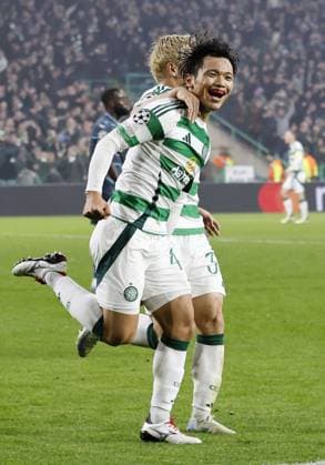 Football: Champions League Reo Hatate (front) of Celtic celebrates after scoring in the second half of a Champions League football match against Leipzig on Nov. 5, 2024, in Glasgow.  A14AA0003691197P