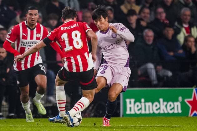 EINDHOVEN, NETHERLANDS - NOVEMBER 5: Olivier Boscagli of PSV and Min-su Kim of Girona FC battle for possession during the UEFA Champions League 2024 25 League Phase MD4 match between PSV Eindhoven and Girona FC at PSV Stadion on November 5, 2024 in Eindhoven, Netherlands. (Photo by Rene Nijhuis) SOC  Copyright: xRenexNijhuis