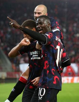 Cyriel Dessers of Rangers celebrates scoring the equalising goal with Mohammed Diomande and Vaclav Cerny Olympiakos v Rangers, UEFA Europa League, Group Stage, Football, Georgios Karaiskakis Stadium, Pireas, Greece - 07 Nov 2024 EDITORIAL USE ONLY No use with unauthorised audio, video, data, fixture lists, club league logos or live services. Online in-match use limited to 120 images, no video emulation. No use in betting, games or single club league player publications. Copyright: xCostasxBaltas Shutterstockx 14878028ao
