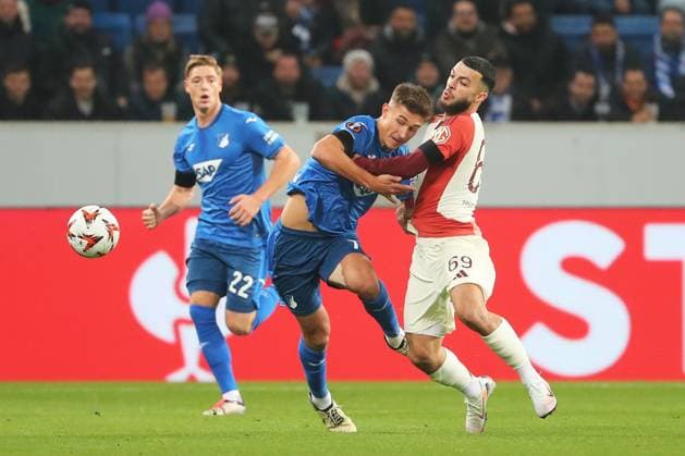 07.11.2024, xtvx, Fussball UEFA Europa League, TSG 1899 Hoffenheim - Olympique Lyon emspor, v.l. Zweikampf, Duell, duel, tackle, compete Tom Bischof (TSG 1899 Hoffenheim) Georges Mikautadze (Olympique Lyon) (DFL DFB REGULATIONS PROHIBIT ANY USE OF PHOTOGRAPHS as IMAGE SEQUENCES and or QUASI-VIDEO) Sinsheim