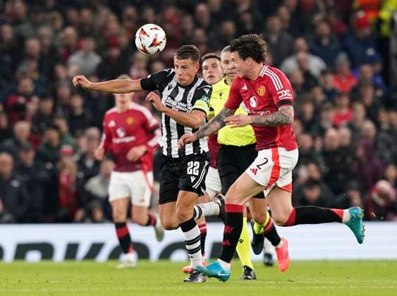 Manchester, England, 7th November 2024. Victor Lindelof of Manchester United, ManU with PAOK s Stefan Schwab during the UEFA Europa League match at Old Trafford, Manchester. Picture credit should read: Andrew Yates Sportimage EDITORIAL USE ONLY. No use with unauthorised audio, video, data, fixture lists, club league logos or live services. Online in-match use limited to 120 images, no video emulation. No use in betting, games or single club league player publications. SPI-3442-0023