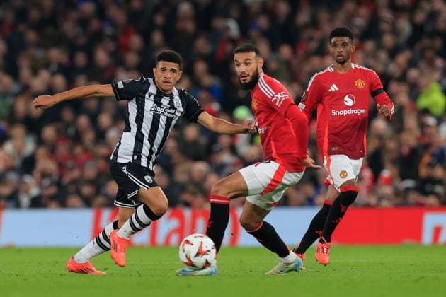 Manchester United, ManU v PAOK Salonica Europa League 07 11 2024. Taison Barcellos Freda (11) of PAOK Salonika passes the ball watched by Noussair Mazraoui (3) of Manchester United during the Europa League match between Manchester United and PAOK Salonica at Old Trafford, Manchester, England on 7 November 2024. Manchester Old Trafford Greater Manchester England Editorial use only , Copyright: xConorxMolloyx PSI-20778-0041