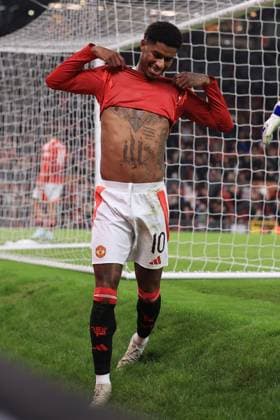 Football - UEFA Europa League - League Phase - Manchester United, ManU v PAOK Salonika 7th November 2024 - UEFA Europa League - League Phase - Manchester United v PAOK Salonika - Marcus Rashford of Manchester United reveals his tattoos on his chest as he reacts - Photo: Simon Stacpoole Offside. Manchester UK Copyright: xSimonxStacpoolexOffside