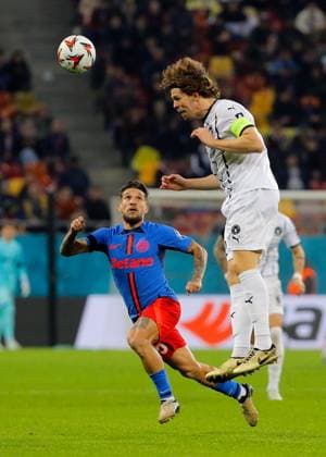 (241108) -- BUCHAREST, Nov. 8, 2024 -- FCSB s Alexandru Baluta (L) vies with Midtjylland s Mads Bech during a UEFA Europa League match between FCSB and Midtjylland in Bucharest, Romania, Nov. 7, 2024. (Photo by Xinhua) (SP)ROMANIA-BUCHAREST-UEFA EUROPA LEAGUE-FCSB VS FC MIDTJYLLAND CristianxCristel 