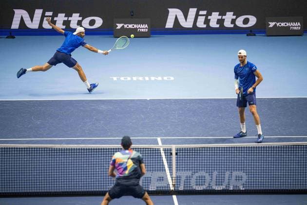 Italy s Simone Bolelli returns the ball as Italy s Andrea Vavassori looks on during the match against Rohan Bopanna, of India and Matthew Ebden of Australia, at the Inalpi Arena in Turin, Italy - - Monday, November 11, 2024. .  Copyright: xMarcoxAlpozzi LaPressex