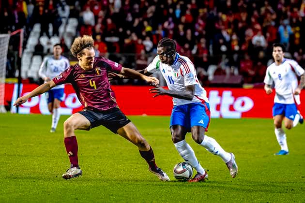 Belgium defender Wout Faes, Italy forwarder Moise Kean, during the match Belgium - Italy at the King Baudouin Stadiu for the UEFA Nations League - League A - Group A2 season 2024-2025 in BRUSSELS, Netherlands on 14 november 2024, (photo by Marcel van Dorst EYE4images DeFodi Images) not used in POL SRB CRO FRA GBR NED ITA USA Defodi-746_200469