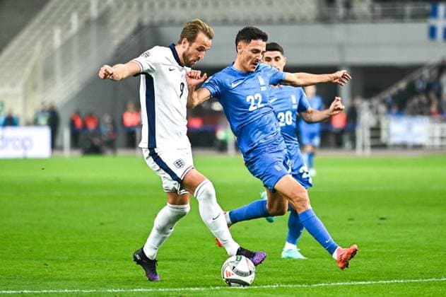 9 Harry Kane of England competes with 22 Dimitris Giannoulis of Greece during the UEFA Nations League 2024 25 League B, Group B2 match between Greece and England on November 14, 2024 at OAKA Stadium, in Athens, Greece.  Copyright: xStefanosxKyriazis IPAxSportx xipx xx IPA_51566824 IPA_Agency_IPA51566824