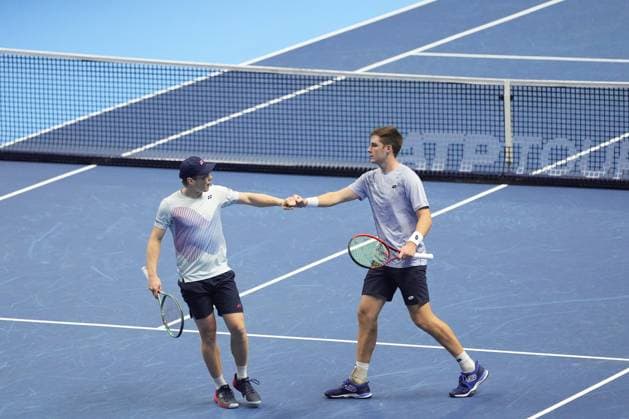 (241117) -- TURIN, Nov. 17, 2024 -- Henry Patten (R) of Britain and Harri Heliovaara of Finland celebrate a point during the men s doubles semifinal match against Marcelo Arevalo of El Salvador and Mate Pavic of Croatia at the Nitto ATP, Tennis Herren Finals in Turin, Italy, on Nov. 16, 2024. ) (SP)ITALY-TURIN-TENNIS-NITTO ATP FINALS-SEMIFINAL-MEN S DOUBLES LixJing 