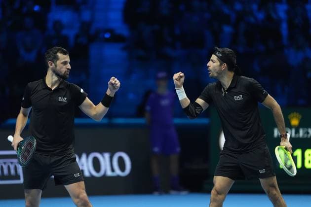 (241117) -- TURIN, Nov. 17, 2024 -- Marcelo Arevalo (R) of El Salvador and Mate Pavic of Croatia celebrate a point during the men s doubles semifinal match against Henry Patten of Britain and Harri Heliovaara of Finland at the Nitto ATP, Tennis Herren Finals in Turin, Italy, on Nov. 16, 2024. ) (SP)ITALY-TURIN-TENNIS-NITTO ATP FINALS-SEMIFINAL-MEN S DOUBLES LixJing 