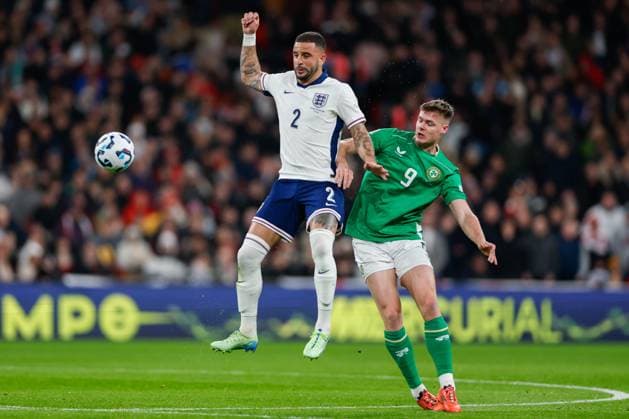 Kyle Walker of England passing the ball mid-air away from Evan Ferguson of Ireland England v Republic of Ireland, Football, UEFA Nations League, Wembley Stadium, Wembley, London, UK - 17 11 2024 Editorial use only  Copyright: xMATTHEWxIMPEY Shutterstockx 14915891x