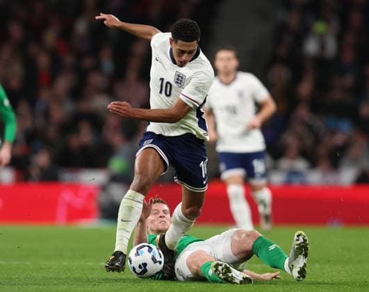 London, England, 17th November 2024. Jude Bellingham of England is challenged by Mark McGuinness of Republic of Ireland during the UEFA Nations League match at Wembley Stadium, London. Picture credit should read: Paul Terry Sportimage EDITORIAL USE ONLY. No use with unauthorised audio, video, data, fixture lists, club league logos or live services. Online in-match use limited to 120 images, no video emulation. No use in betting, games or single club league player publications. SPI-3458-0053