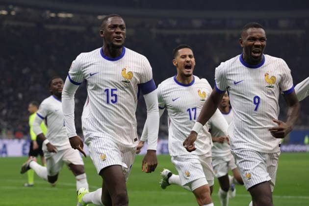 Milan, Italy, 17th November 2024. William Saliba, Ibrahima Konate and Marcus Thuram of France celebrate after teram mate Adrien Rabiot scored to give the side a 1-0 lead during the UEFA Nations League match at Stadio Giuseppe Meazza, Milan. Picture credit should read: Jonathan Moscrop Sportimage EDITORIAL USE ONLY. No use with unauthorised audio, video, data, fixture lists, club league logos or live services. Online in-match use limited to 120 images, no video emulation. No use in betting, games or single club league player publications. SPI-3453-0007