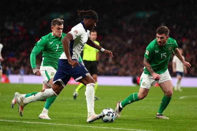 17th November 2024; Wembley Stadium, London, England; Nations League, League B, Group 2 International Football, England versus Republic of Ireland; Noni Madueke of England takes on Sammie Szmodics and Ryan Manning of Republic of Ireland  ActionPlus12716826 ShaunxBrooks