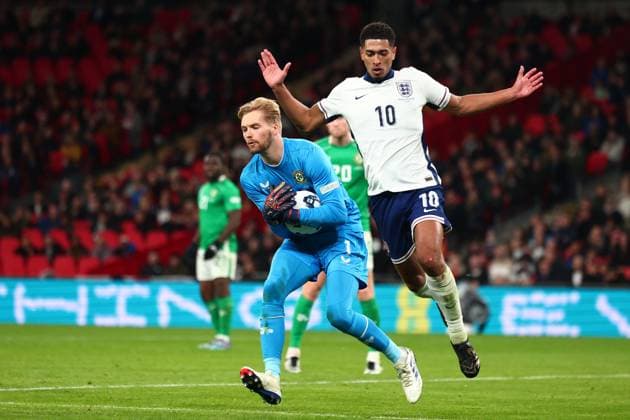 17th November 2024; Wembley Stadium, London, England; Nations League, League B, Group 2 International Football, England versus Republic of Ireland; Caoimhin Kelleher of Republic of Ireland is under pressure from Jude Bellingham of England as he collects the through ball  ActionPlus12716831 ShaunxBrooks