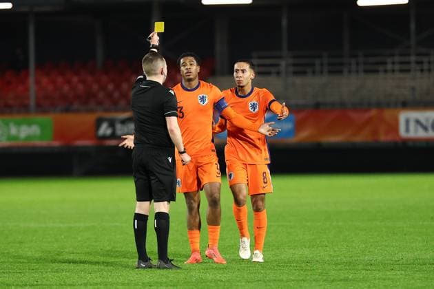 ALMERE , 18-11-2024 , Yanmar stadium , season 2024 2025 , UEFA European U21, U 21 Football 2025 Friendly match. (L-R) referee Kevin O Sullivan Netherlands U21 player Anass Salah-Eddine yellow card during the match Netherlands U21 - England U21 Netherlands U21 - England U21  x26776746x Copyright: