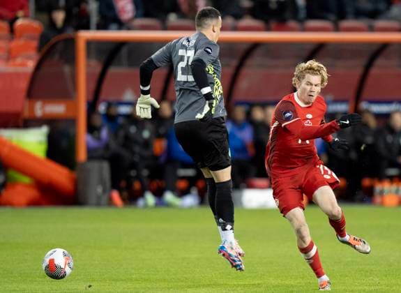 November 19, 2024, Toronto, On, CANADA: Canada forward Jacob Shaffelburg (14) gets past Suriname keeper Etienne Vaessen (23) on his way to scoring in CONCACAF Nations League action in Toronto, Tuesday, Nov. 19, 2024. Canada News - November 19, 2024  - ZUMAc35_ 20241119_zaf_c35_135 Copyright: xFrankxGunnx