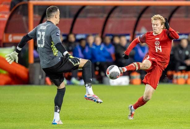 November 19, 2024, Toronto, On, CANADA: Canada forward Jacob Shaffelburg (14) battles for the ball with Suriname keeper Etienne Vaessen on his way to scoring in CONCACAF Nations League action in Toronto, Tuesday, Nov. 19, 2024. Canada News - November 19, 2024  - ZUMAc35_ 20241119_zaf_c35_141 Copyright: xFrankxGunnx