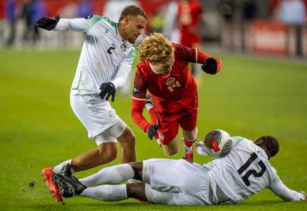 November 19, 2024, Toronto, On, CANADA: Canada forward Jacob Shaffelburg (14) is tackled hard by Suriname defenders Leo Abena (12) and Liam Van Gelderen (2) in CONCACAF Nations League action in Toronto, Tuesday, Nov. 19, 2024. Canada News - November 19, 2024  - ZUMAc35_ 20241119_zaf_c35_145 Copyright: xFrankxGunnx