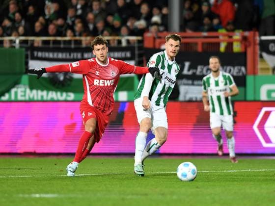 Luca Waldschmidt (1. FC Koeln) und Niko Koulis (Preussen Muenster) im Zweikampf waehrend des Spiels der 2. Bundesliga zwischen Preußen Münster und 1. FC Köln im Preußenstadion am 22. November 2024 in Münster, Deutschland. (Foto von Ralf Treese DeFodi Images) +++ Luca Waldschmidt (1. FC Koeln) und Niko Koulis (Preussen Muenster) battle for the ball during the 2. Bundesliga match between Preußen Münster and 1. FC Köln at Preußenstadion on November 22, 2024 in Münster, Germany. (Photo by Ralf Treese DeFodi Images) DFB DFL REGULATIONS PROHIBIT ANY USE OF PHOTOGRAPHS AS IMAGE SEQUENCES AND OR QUASI-VIDEO. Defodi-521_SCPKOE20241122_013