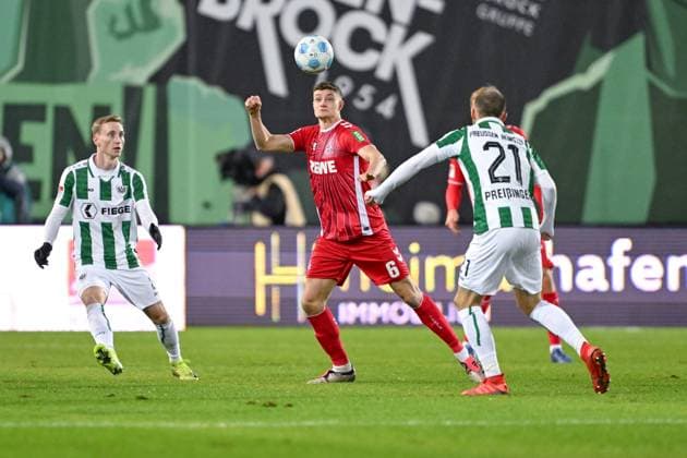 22.11.2024, Fussball, 2. Bundesliga, 13. Spieltag Saison 2024 2025, Preußen Münster - 1.FC Köln, Eric Martel (1. FC Köln), Rico Preißinger (Preußen Münster) xRHR-FOTO TKx