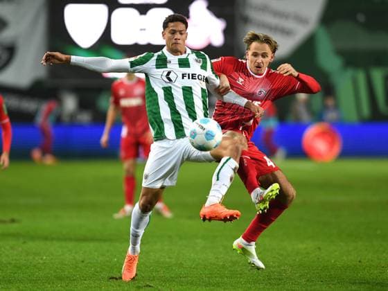 Andras Nemeth (Preussen Muenster) und Mathias Olesen (1. FC Koeln) im Zweikampf waehrend des Spiels der 2. Bundesliga zwischen Preußen Münster und 1. FC Köln im Preußenstadion am 22. November 2024 in Münster, Deutschland. (Foto von Ralf Treese DeFodi Images) +++ Andras Nemeth (Preussen Muenster) und Mathias Olesen (1. FC Koeln) battle for the ball during the 2. Bundesliga match between Preußen Münster and 1. FC Köln at Preußenstadion on November 22, 2024 in Münster, Germany. (Photo by Ralf Treese DeFodi Images) DFB DFL REGULATIONS PROHIBIT ANY USE OF PHOTOGRAPHS AS IMAGE SEQUENCES AND OR QUASI-VIDEO. Defodi-521_SCPKOE20241122_020