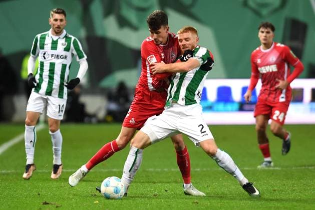 Dejan Ljubicic (1. FC Köln) und Mikkel Kirkeskov (Preussen Muenster) im Zweikampf waehrend des Spiels der 2. Bundesliga zwischen Preußen Münster und 1. FC Köln im Preußenstadion am 22. November 2024 in Münster, Deutschland. (Foto von Ralf Treese DeFodi Images) +++ Dejan Ljubicic (1. FC Köln) und Mikkel Kirkeskov (Preussen Muenster) battle for the ball during the 2. Bundesliga match between Preußen Münster and 1. FC Köln at Preußenstadion on November 22, 2024 in Münster, Germany. (Photo by Ralf Treese DeFodi Images) DFB DFL REGULATIONS PROHIBIT ANY USE OF PHOTOGRAPHS AS IMAGE SEQUENCES AND OR QUASI-VIDEO. Defodi-521_SCPKOE20241122_022