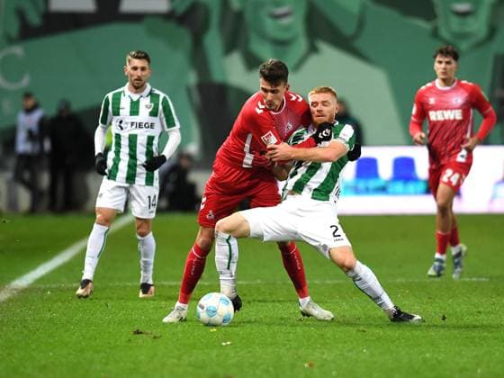 Dejan Ljubicic (1. FC Köln) und Mikkel Kirkeskov (Preussen Muenster) im Zweikampf waehrend des Spiels der 2. Bundesliga zwischen Preußen Münster und 1. FC Köln im Preußenstadion am 22. November 2024 in Münster, Deutschland. (Foto von Ralf Treese DeFodi Images) +++ Dejan Ljubicic (1. FC Köln) und Mikkel Kirkeskov (Preussen Muenster) battle for the ball during the 2. Bundesliga match between Preußen Münster and 1. FC Köln at Preußenstadion on November 22, 2024 in Münster, Germany. (Photo by Ralf Treese DeFodi Images) DFB DFL REGULATIONS PROHIBIT ANY USE OF PHOTOGRAPHS AS IMAGE SEQUENCES AND OR QUASI-VIDEO. Defodi-521_SCPKOE20241122_023