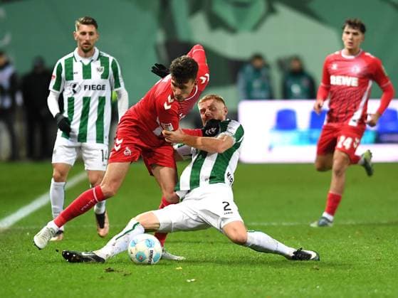 Dejan Ljubicic (1. FC Köln) und Mikkel Kirkeskov (Preussen Muenster) im Zweikampf waehrend des Spiels der 2. Bundesliga zwischen Preußen Münster und 1. FC Köln im Preußenstadion am 22. November 2024 in Münster, Deutschland. (Foto von Ralf Treese DeFodi Images) +++ Dejan Ljubicic (1. FC Köln) und Mikkel Kirkeskov (Preussen Muenster) battle for the ball during the 2. Bundesliga match between Preußen Münster and 1. FC Köln at Preußenstadion on November 22, 2024 in Münster, Germany. (Photo by Ralf Treese DeFodi Images) DFB DFL REGULATIONS PROHIBIT ANY USE OF PHOTOGRAPHS AS IMAGE SEQUENCES AND OR QUASI-VIDEO. Defodi-521_SCPKOE20241122_024