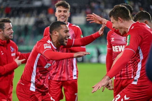 22.11.2024, Fussball, 2. Bundesliga, 13. Spieltag Saison 2024 2025, Preußen Münster - 1.FC Köln, Linton Maina (1. FC Köln), Dominique Heintz (1. FC Köln) xRHR-FOTO TKx