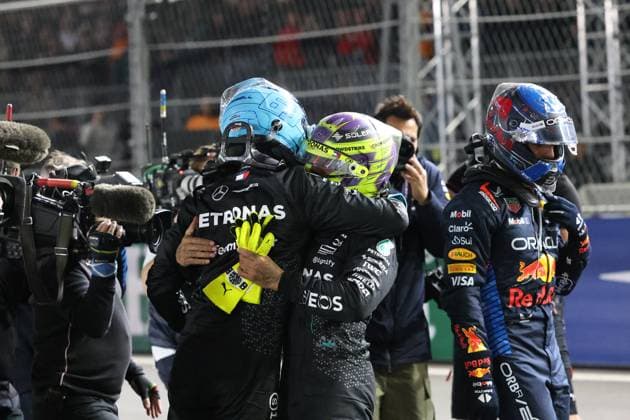 LAS VEGAS, NV - NOVEMBER 23: Max Verstappen (1) Oracle Red Bull Racing walks by George Russell (63) Mercedes-AMG PETRONAS F1 Team and Lewis Hamilton (44) Mercedes-AMG PETRONAS F1 Team after winning his fourth F1 world title at the F1 Heineken Silver Las Vegas Grand Prix on Saturday, Nov. 23, 2024, at the Las Vegas Street Circuit in Las Vegas, Nevada. (Photo by Marc Sanchez Icon Sportswire) AUTO: NOV 23 F1 Heineken Silver Las Vegas Grand Prix EDITORIAL USE ONLY Icon1442411238261