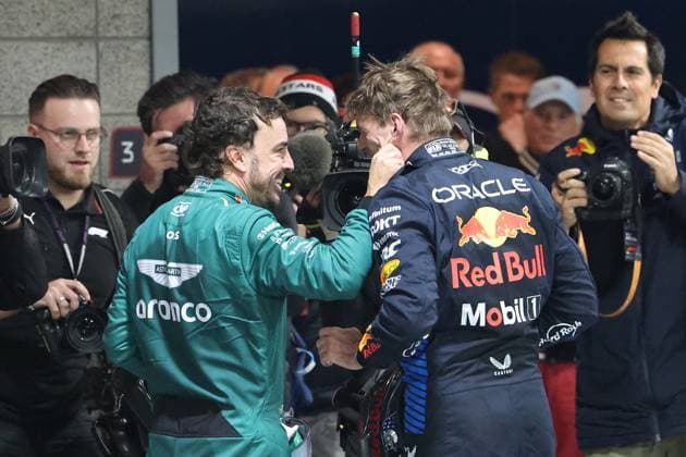 LAS VEGAS, NV - NOVEMBER 23: Fernando Alonso(14) Aston Martin Armco F1 Team pinches the cheek of Max Verstappen (1) Oracle Red Bull Racing at the conclusion of the F1 Heineken Silver Las Vegas Grand Prix on Saturday, Nov. 23, 2024, at the Las Vegas Street Circuit in Las Vegas, Nevada. (Photo by Marc Sanchez Icon Sportswire) AUTO: NOV 23 F1 Heineken Silver Las Vegas Grand Prix EDITORIAL USE ONLY Icon14424112310651