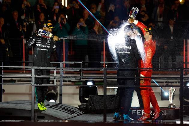 LAS VEGAS, NV - NOVEMBER 23: George Russell (63, back turned) of Great Britain, Mercedes-AMG PETRONAS F1, Team Mercedes is sprayed with champagne by Carlos Sainz (55, right, 3rd place) of Spain, Scuderia Ferrari and Lewis Hamilton (44, left, 2nd place) of Great Britain, Mercedes-AMG PETRONAS F1, Team Mercedes at the completion of the Formula 1 Heineken Silver Las Vegas Grand Prix on the Las Vegas Strip Circuit on November 23, 2024 in Las Vegas, Nevada. (Photo by Jeff Speer Icon Sportswire) AUTO: NOV 23 F1 Heineken Silver Las Vegas Grand Prix EDITORIAL USE ONLY Icon2411231731