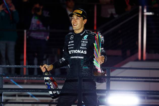 LAS VEGAS, NV - NOVEMBER 23: George Russell (63) of Great Britain, Mercedes-AMG PETRONAS F1, Team Mercedes celebrates with the trophy after winning the Formula 1 Heineken Silver Las Vegas Grand Prix on the Las Vegas Strip Circuit on November 23, 2024 in Las Vegas, Nevada. (Photo by Jeff Speer Icon Sportswire) AUTO: NOV 23 F1 Heineken Silver Las Vegas Grand Prix EDITORIAL USE ONLY Icon2411231751