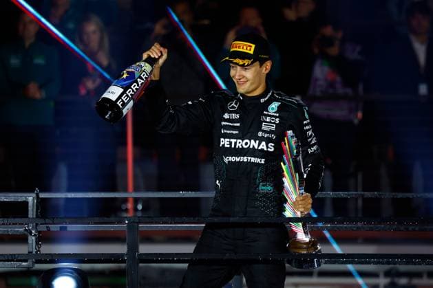 LAS VEGAS, NV - NOVEMBER 23: George Russell (63) of Great Britain, Mercedes-AMG PETRONAS F1, Team Mercedes celebrates with the trophy after winning the Formula 1 Heineken Silver Las Vegas Grand Prix on the Las Vegas Strip Circuit on November 23, 2024 in Las Vegas, Nevada. (Photo by Jeff Speer Icon Sportswire) AUTO: NOV 23 F1 Heineken Silver Las Vegas Grand Prix EDITORIAL USE ONLY Icon2411231771