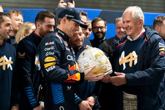 Dutch Formula One driver Max Verstappen of Red Bull Racing receives a helmet from advisor Helmut Marko for winning his fourth drivers World Championship, WM, Weltmeisterschaft following the Formula One Las Vegas Grand Prix at the Las Vegas Strip Circuit in Las Vegas on Sunday, November 24, 2024.  LAV2024112404 GREGxNASH