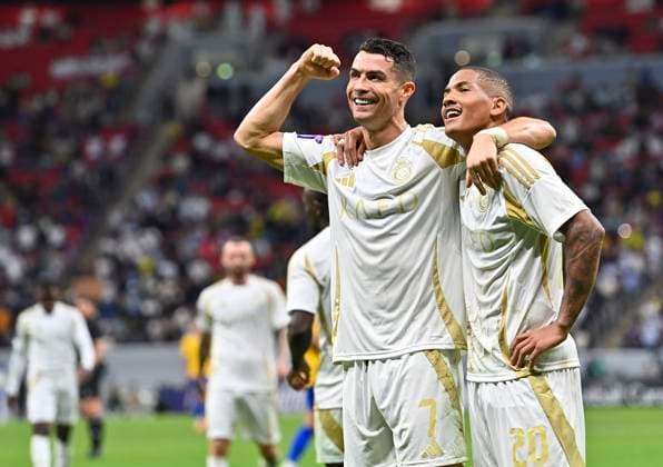 (241126) -- AL KHOR, Nov. 26, 2024 -- Cristiano Ronaldo (L) of Al Nassr FC celebrates after scoring opening goal during the AFC Champions League elite football match between Qatar s Al Gharafa SC and Saudi Arabia s Al Nassr FC at Al-Bayt Stadium in Al Khor, Qatar, on Nov. 25, 2024. (Photo by Xinhua) (SP)QATAR-AL KHOR-FOOTBALL-AFC CHAMPIONS LEAGUE-AL GHARAFA SC-AL NASSR FC Nikku 