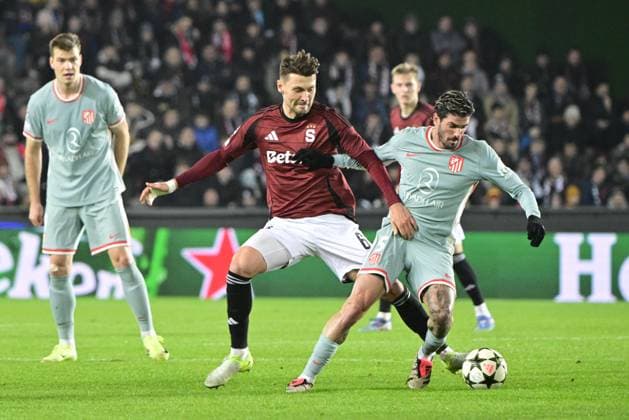 Kaan Kairinen of Sparta, left and Rodrigo De Paul of Atletico, right, in action during the football Champions League 5th round match Sparta Praha vs Atletico Madrid in Prague, Czech Republic, November 26, 2024. (CTKxPhoto RomanxVondrous) CTKPhotoP2024112606999  CTKPhotoP2024112606999