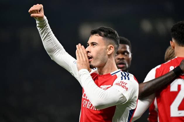 Gabriel Martinelli of Arsenal celebrates scoring the opening goal for their side with their teammates Sporting Lisbon v Arsenal, UEFA Champions League, Group Stage, Football, Estadio Jose Alvalade, Lisbon, Portugal - 26 Nov 2024 EDITORIAL USE ONLY No use with unauthorised audio, video, data, fixture lists, club league logos or live services. Online in-match use limited to 120 images, no video emulation. No use in betting, games or single club league player publications. Copyright: xZedxJameson Shutterstockx 14940177t