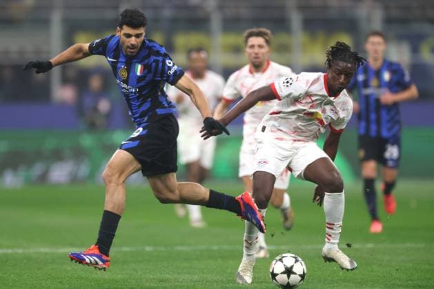 Milan, Italy, 26th November 2024. Mehdi Taremi of FC Internazionale and Amadou Haidara of RB Leipzig during the UEFA Champions League match at Stadio Giuseppe Meazza, Milan. Picture credit should read: Jonathan Moscrop Sportimage EDITORIAL USE ONLY. No use with unauthorised audio, video, data, fixture lists, club league logos or live services. Online in-match use limited to 120 images, no video emulation. No use in betting, games or single club league player publications. SPI-3475-0004