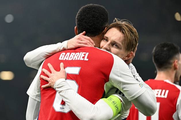 Gabriel Magalhaes of Arsenal celebrates scoring a goal for their side to make it 3-0 with Martin odegaard of Arsenal Sporting Lisbon v Arsenal, UEFA Champions League, Group Stage, Football, Estadio Jose Alvalade, Lisbon, Portugal - 26 Nov 2024 EDITORIAL USE ONLY No use with unauthorised audio, video, data, fixture lists, club league logos or live services. Online in-match use limited to 120 images, no video emulation. No use in betting, games or single club league player publications.  Copyright: xZedxJameson Shutterstockx 14940177cw