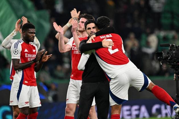 Arsenal head coach Mikel Arteta and William Saliba of Arsenal celebrate at full-time Sporting Lisbon v Arsenal, UEFA Champions League, Group Stage, Football, Estadio Jose Alvalade, Lisbon, Portugal - 26 Nov 2024 EDITORIAL USE ONLY No use with unauthorised audio, video, data, fixture lists, club league logos or live services. Online in-match use limited to 120 images, no video emulation. No use in betting, games or single club league player publications.  Copyright: xZedxJameson Shutterstockx 14940177gb