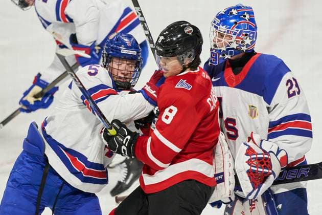 November 26, 2024, London, On, Canada: CHL prospect Justin Carbonneau (centre) battles with USA prospect Lincoln Kuehne (left) and goaltender Donny Bracco during the second period of the CHL-USA Prospects Challenge game in London, Ont. on Tuesday, November 26, 2024. Canada News - November 26, 2024  - ZUMAc35_ 20241126_zaf_c35_104 Copyright: xGeoffxRobinsx