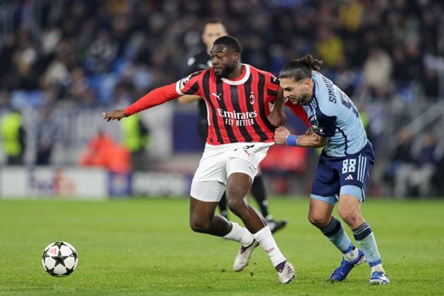 Slovan Bratislava Vs AC Milan in Bratislava, Slovakia - 26 Nov 2024 Youssouf Fofana of AC Milan (L) and Kyriakos Savvidis of Slovan Bratislava (R) seen in action during the UEFA Champions League match between Slovan Bratislava and AC Milan at Tehelne Pole Stadium. Final Score; Slovan Bratislava 2:3 AC Milan. Bratislava Slovakia Copyright: xGrzegorzxWajdax xSOPAxImagesx SLOMIL_26112024_46