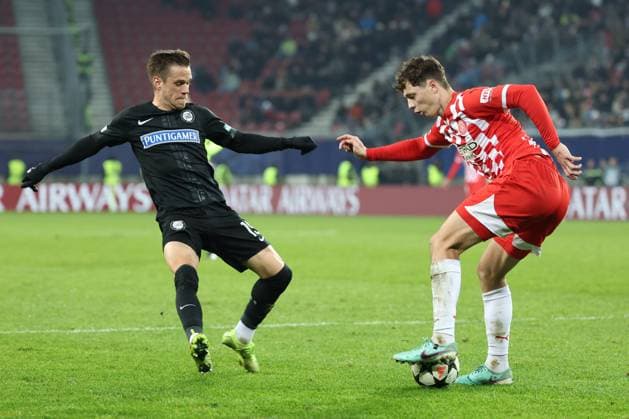 SOCCER - UEFA CL, Sturm vs Girona KLAGENFURT,AUSTRIA,27.NOV.24 - SOCCER - UEFA Champions League, SK Sturm Graz vs Girona FC. Image shows Tomi Horvat (Sturm) and Alejandro Frances (Girona).  GEPAxpictures xChrisxBauer
